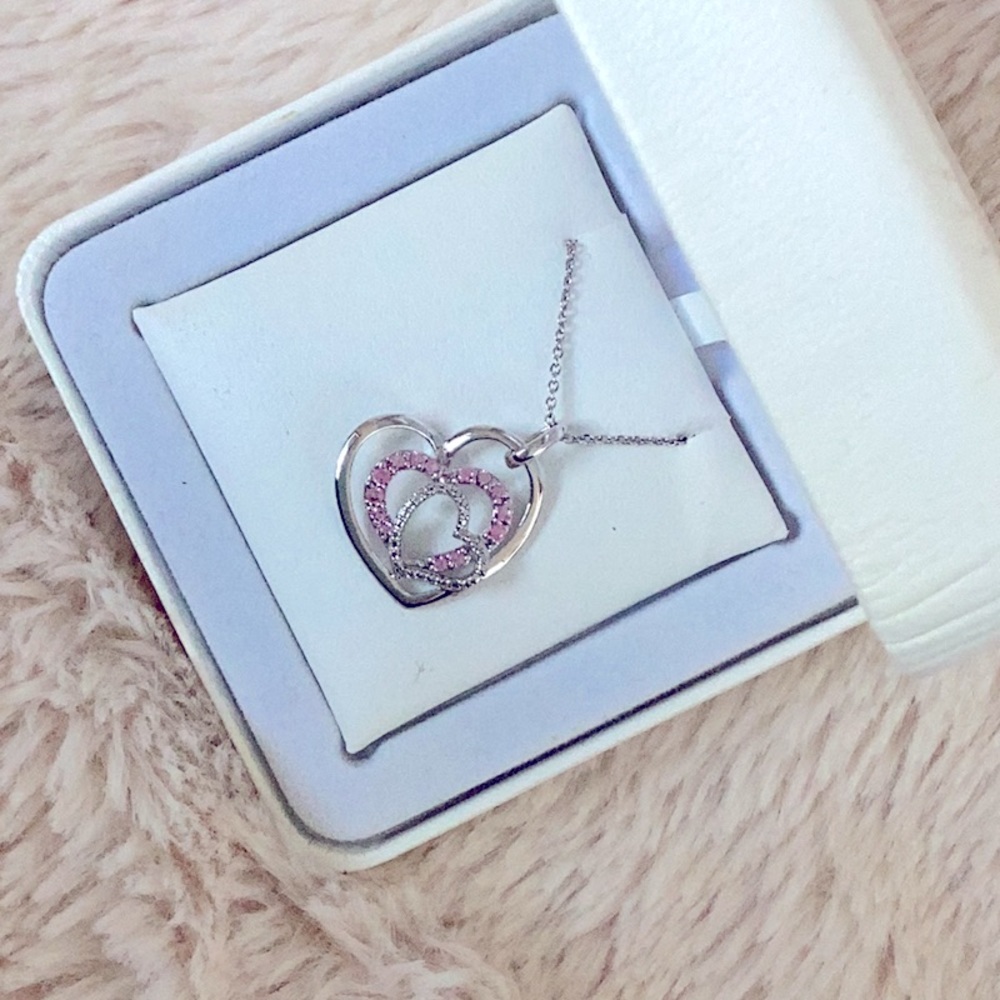 Silver necklace pendant with pink diamonds